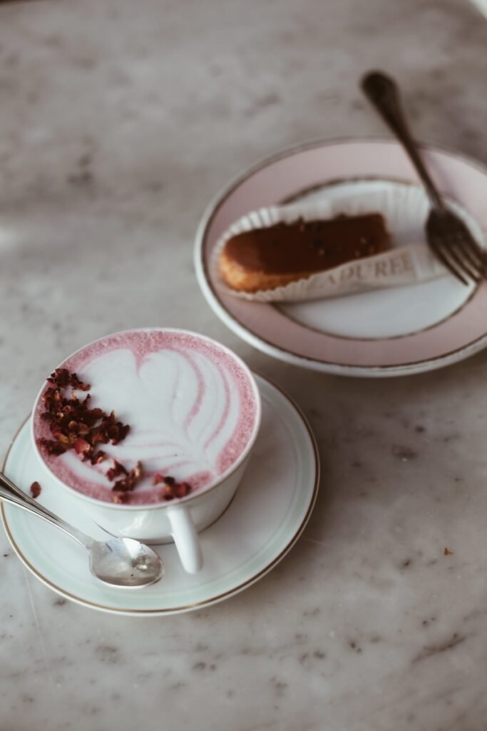 a couple of cups with brown liquid and chocolate in them