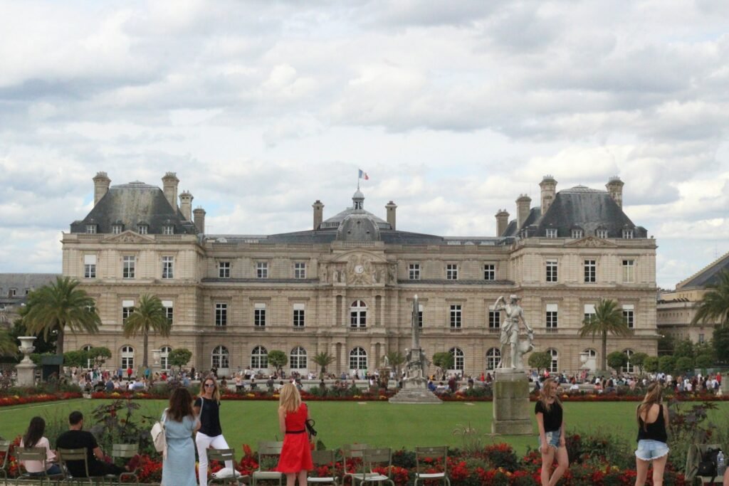 a large building with a lawn in front of it