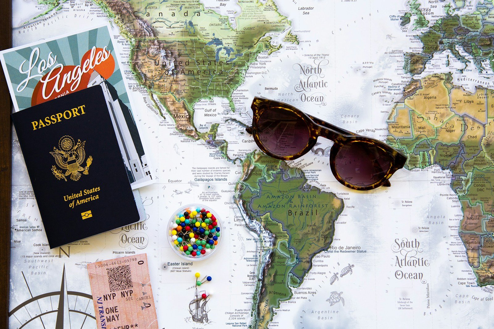 Photo by GeoJango Maps brown framed sunglasses on map